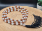 Preview: Handgefertigte Rudraksha & Quartz Mala aus Nepal mit feinen Metall-Spacern und schwarzer Quaste.